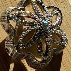 Aurora borealis domed, multi-petaled flower brooch rhinestones or crystals.
